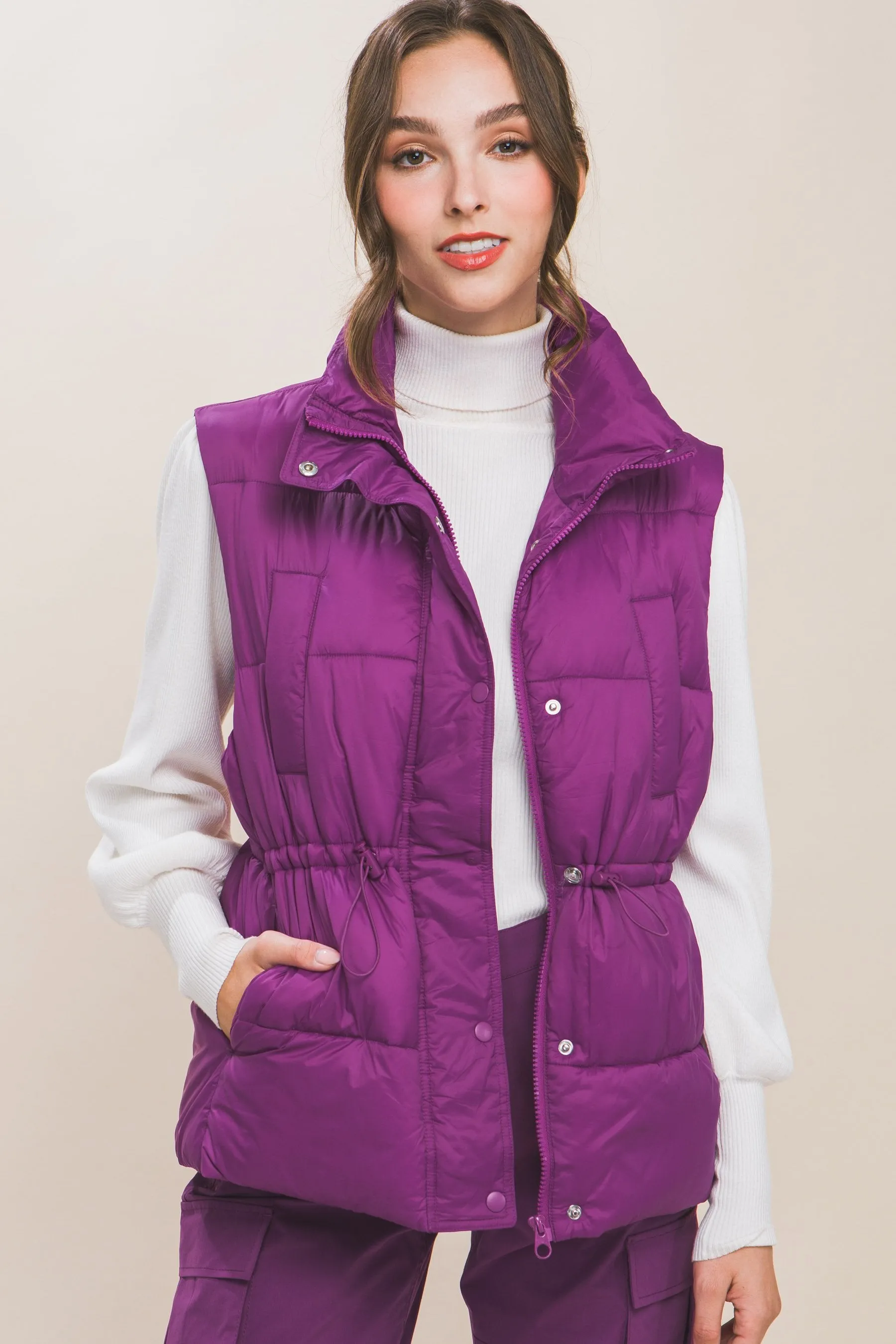 Women's Color Zip up button puffer vest with waist toggles