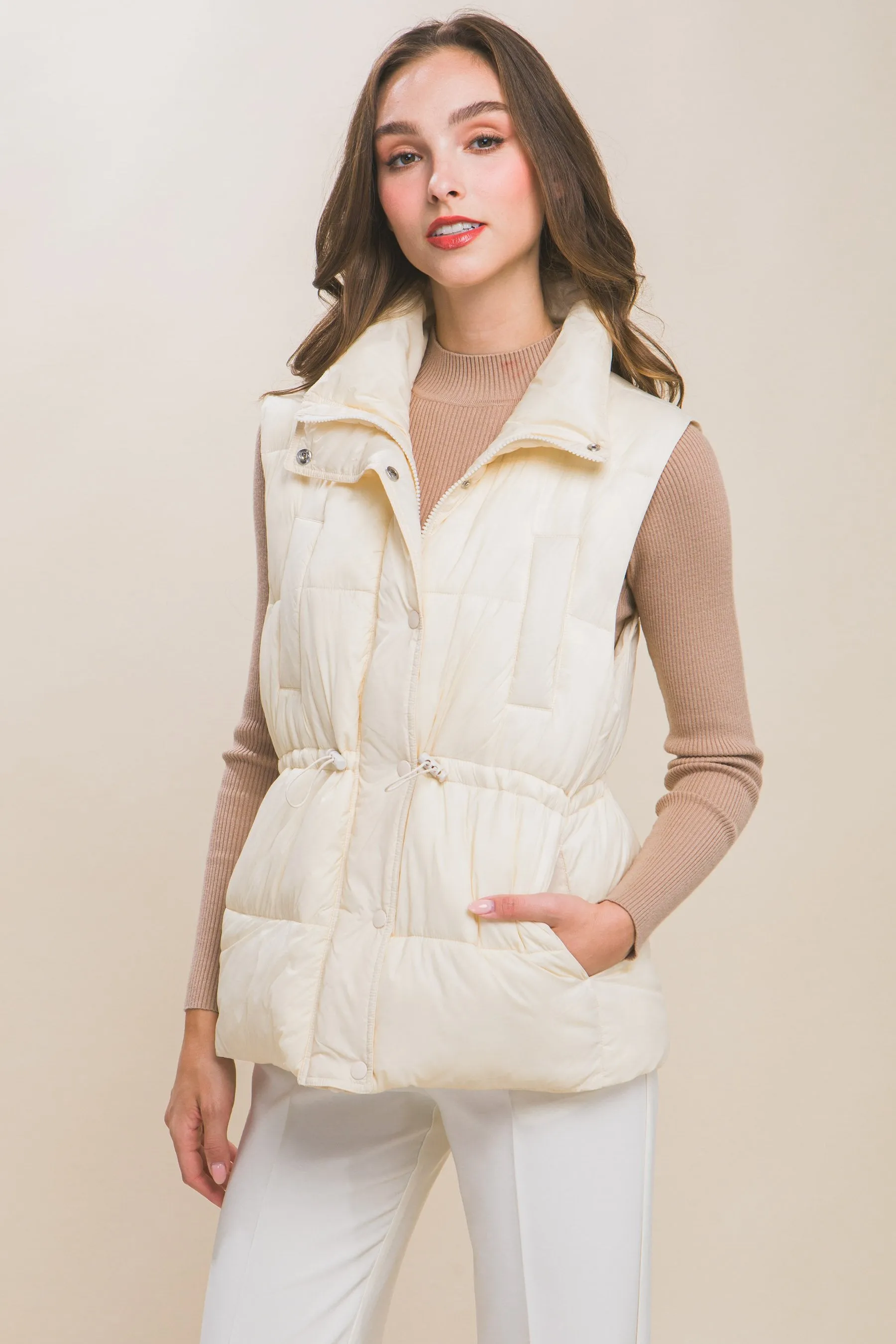 Women's Color Zip up button puffer vest with waist toggles