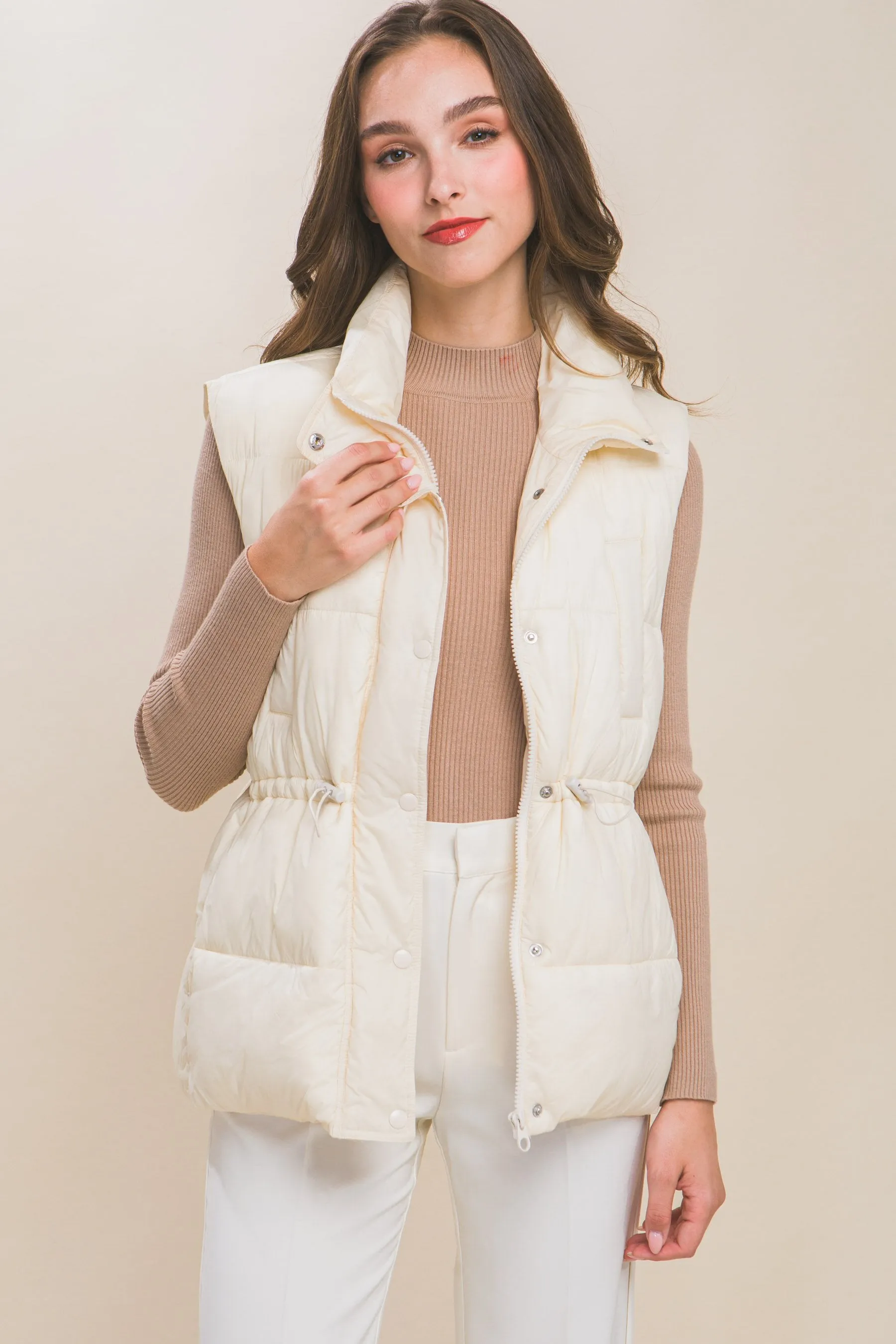 Women's Color Zip up button puffer vest with waist toggles